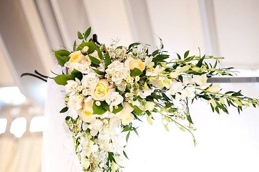 Hanging tea lights and beads for an elegant outdoor ceremony