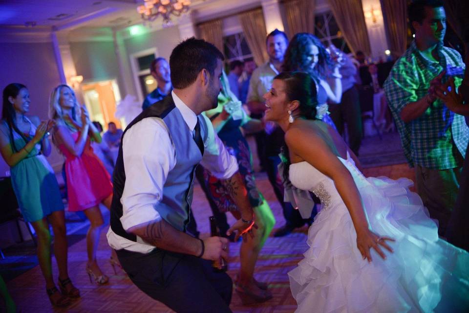 Couple and guests dancing