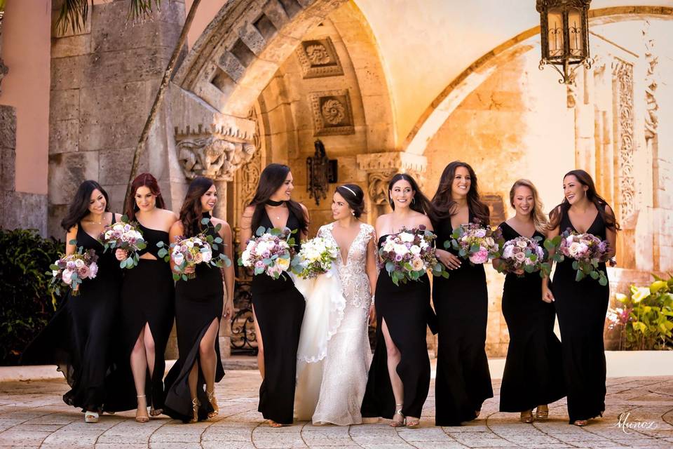 Bride walking with her bridesmaids