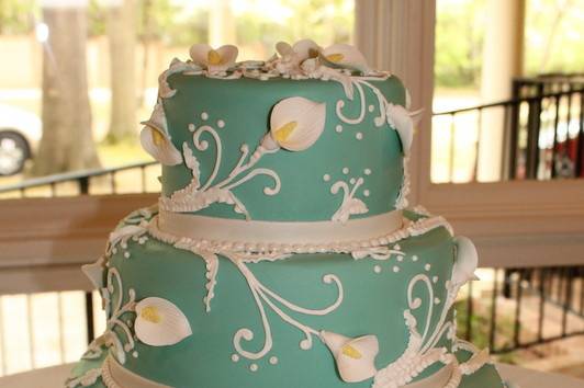 3-tier teal wedding cake with white detailing