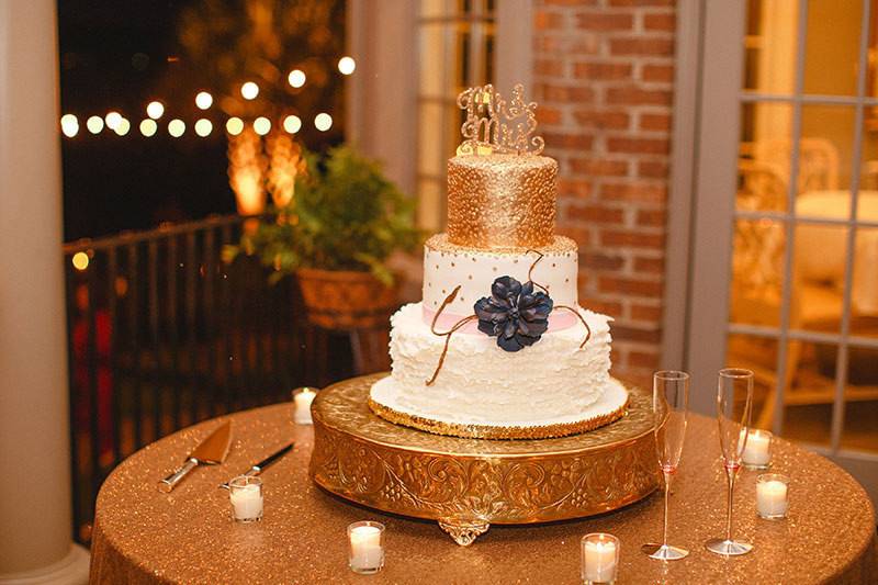 3-tier wedding cake with a gold top layer