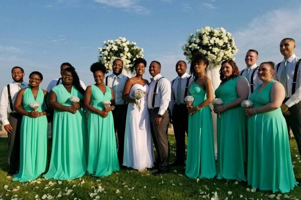The couple with the bridesmaids and groomsmen