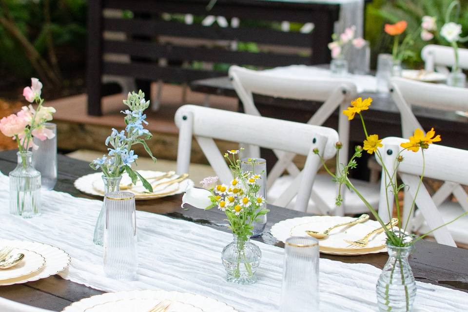 Bud vases on long table