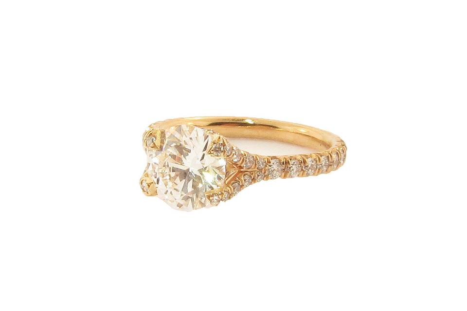 18 karat rose gold solitaire engagement ring with brilliant cut diamond.