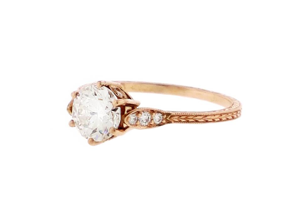 Vintage style rose gold engagement ring with brilliant cut diamond