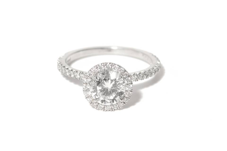 Brilliant cut engagement ring with diamond halo in platinum