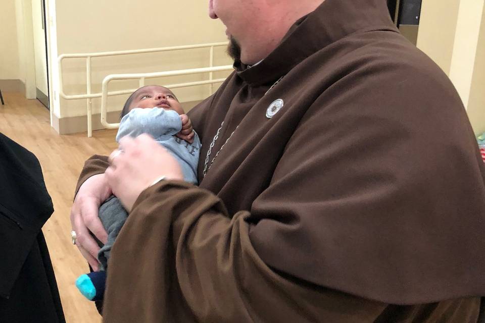 Bishop Greg with baby