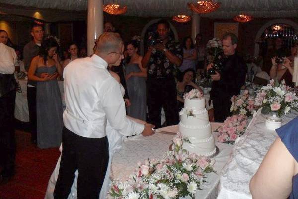 Videographer Michael Clinton (center) filming a cake cutting ceremony at Adelphia's in Deptford NJ.