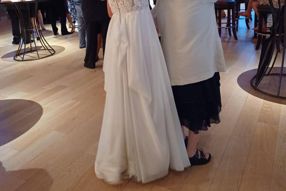 Bride and mom dancing