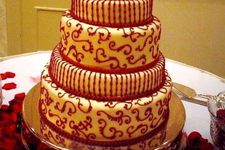 Crimson and white for a Bama bride.  Red velvet cake on the inside complements the white chocolate fondant.