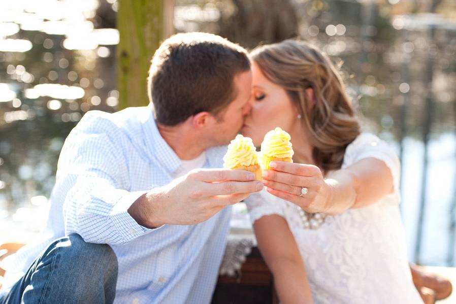 Happily engaged and celebrating with cupcakes