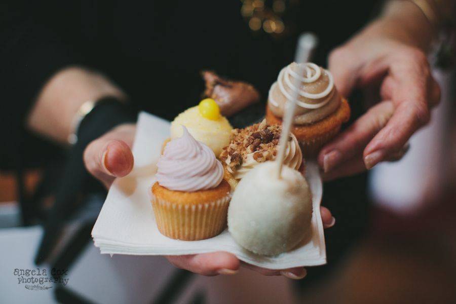 Guests enjoying wedding cupcakes