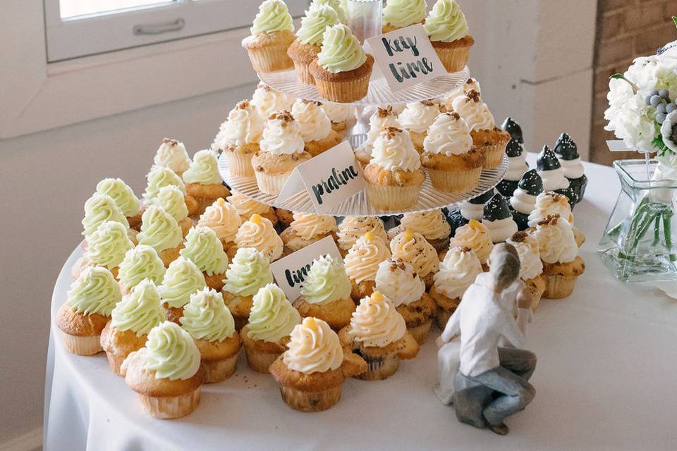 Wedding cupcakes on tiers at an elegant wedding