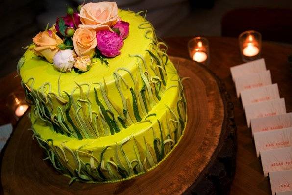 Grass cake with place cards on sod.