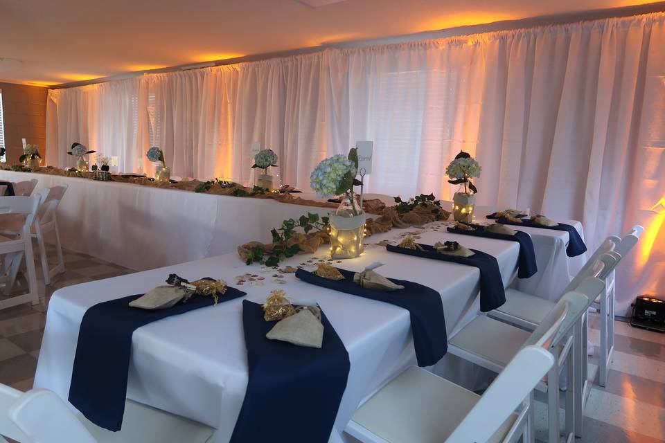 Pipe and drape with yellow uplighting