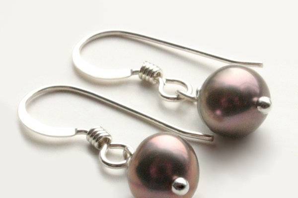 Sugar Plum EarringsThese silvery plum freshwater pearls are super cute and dainty attached to sterling silver french hook style earwires.All silver components are sterling silver.Length (including earwire) - 1