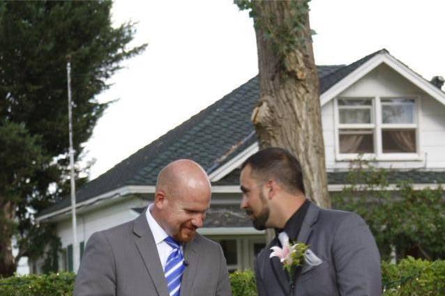 The groom and the officiant chatting