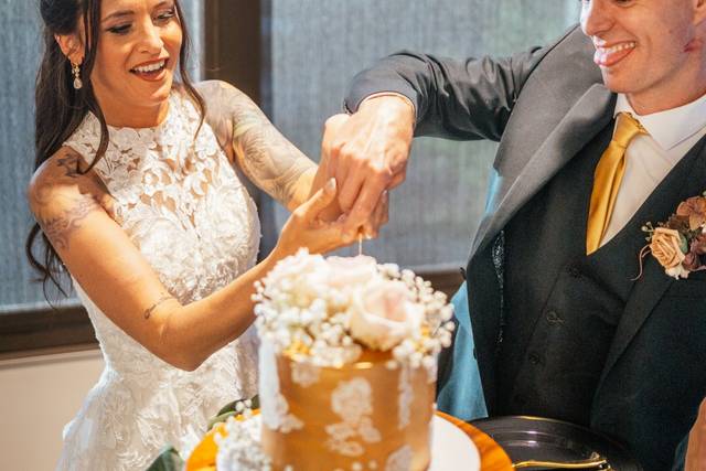 The Newlyweds' Cutting Cake