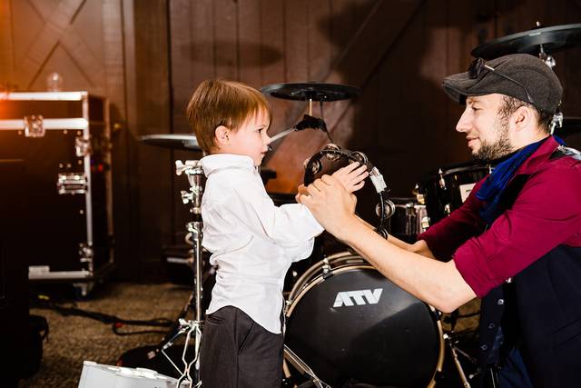 Isaac teaching tambourine