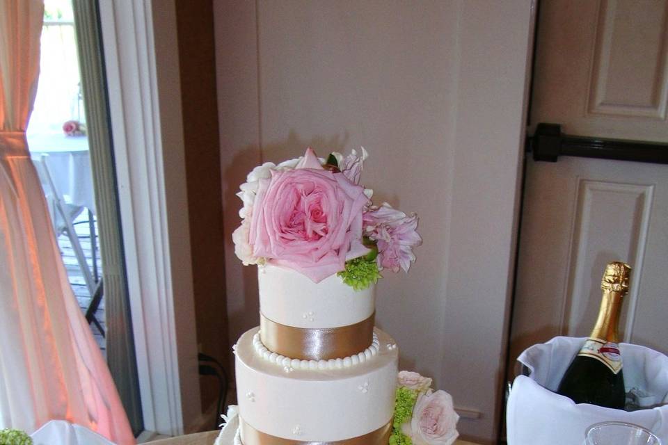 Wedding cake with gold ribbons