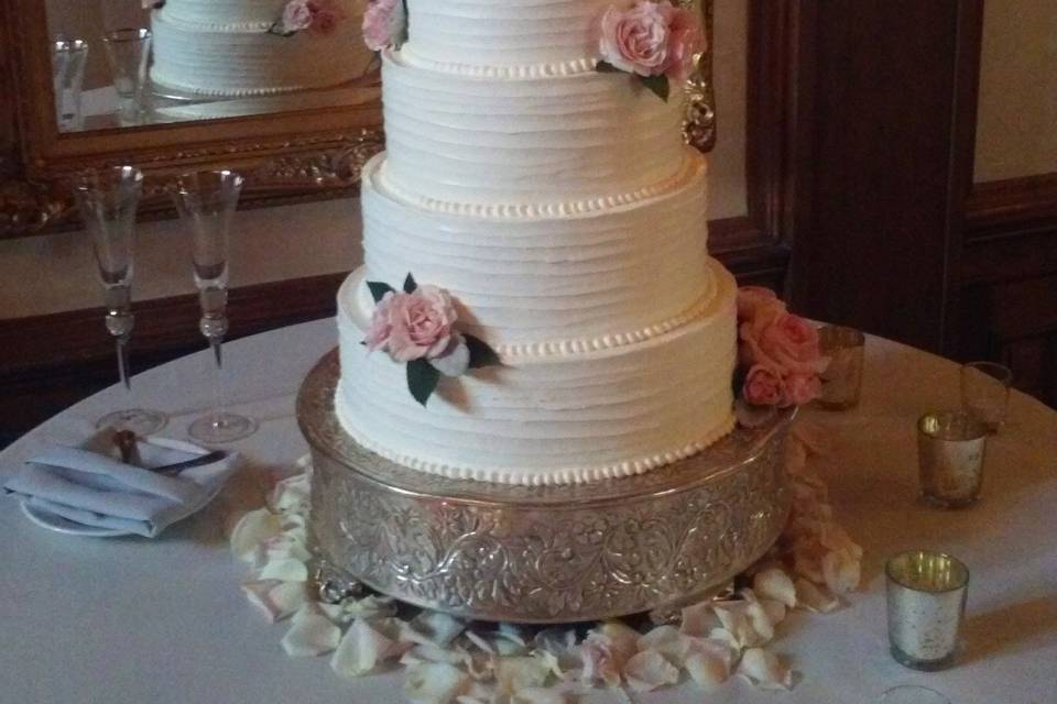 White wedding cake with flowers