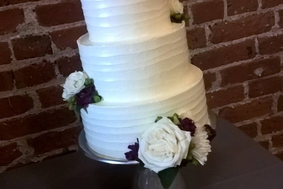 White wedding cake with white flowers