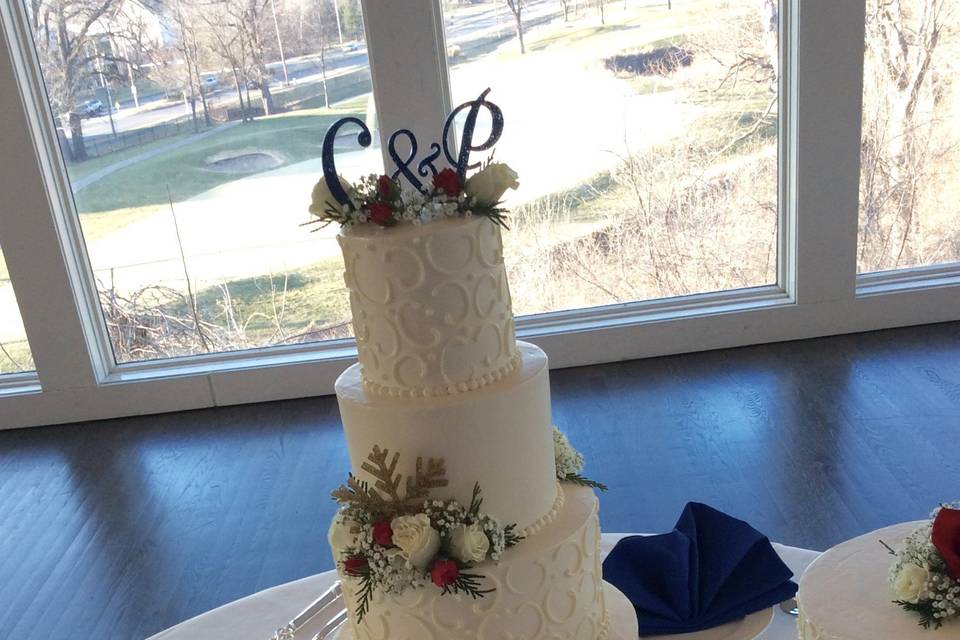 White wedding cake with C & P on top