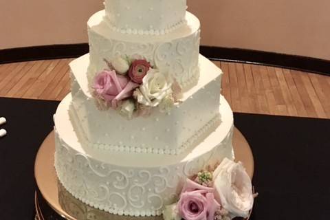 White wedding cake with pink flowers