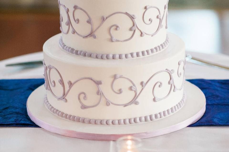 White cake with purple flowers