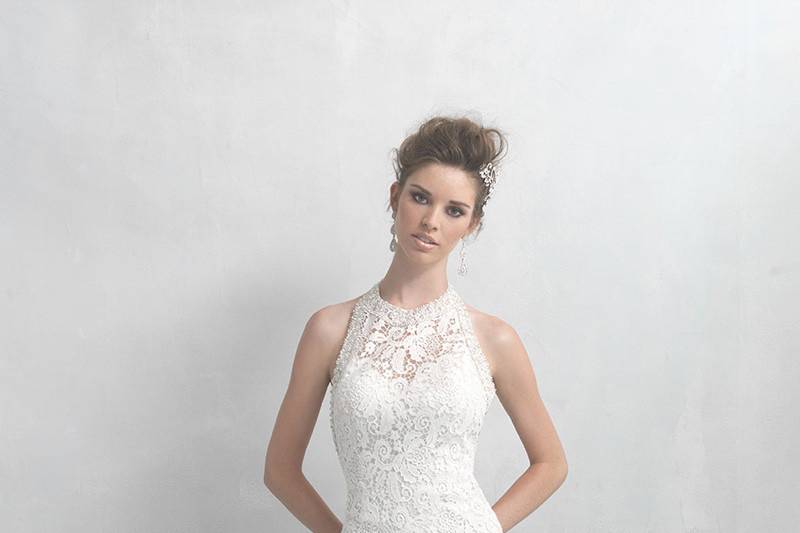 Madison James	Style	MJ18	<br>	Ideal for the slightly mod, sophisticated bride, this floral lace sheath features a beaded halter neckline balanced by a deep, scooped back.