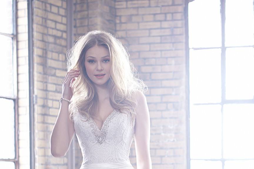 Style MJ159 <br> This sweet ballgown has everything you could possibly want — from layers of tulle to a romantic scooped back.