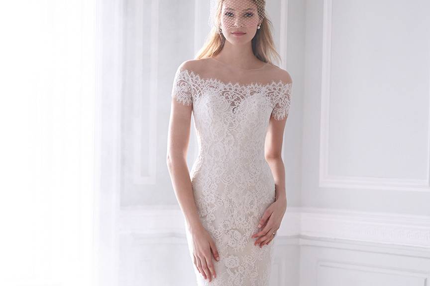 Style MJ166 <br> This gown is breathtaking — with bateau-style lace edging across the illusion neckline and a slim silhouette.