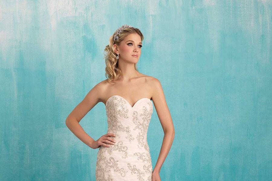 Style 9300 <br> Crystalline details and a slightly asymmetric bodice add a touch of whimsy to this strapless gown.