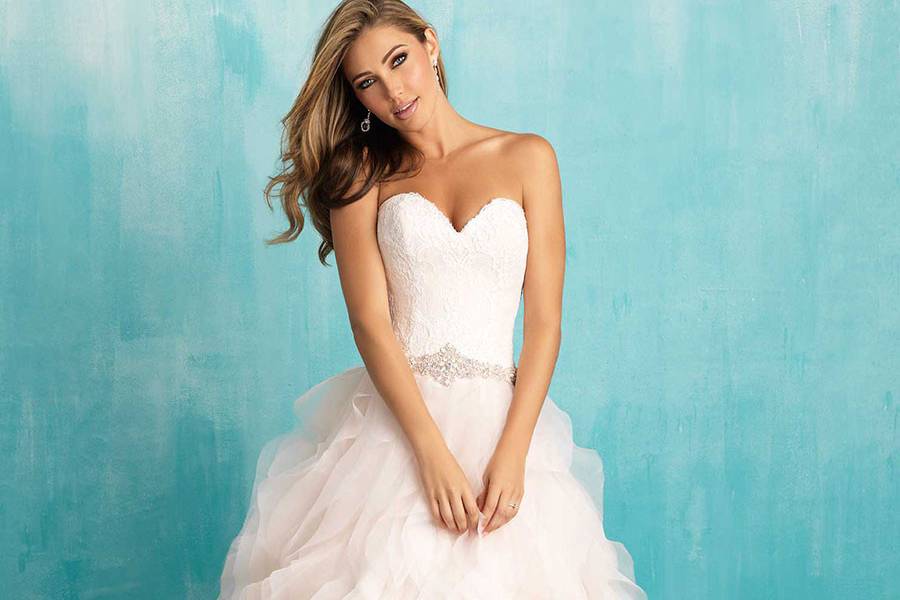 Style 9308 <br> Layers of sheer ruffles bring ethereal texture to this strapless ballgown.