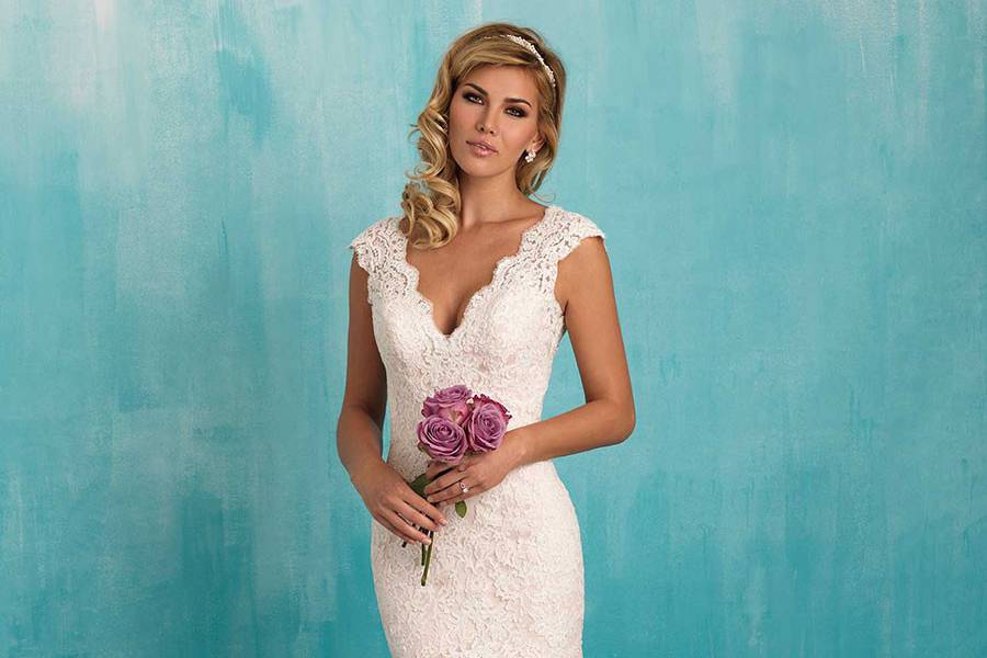 Style 9320 <br> Classic lace composes this simple yet striking gown.