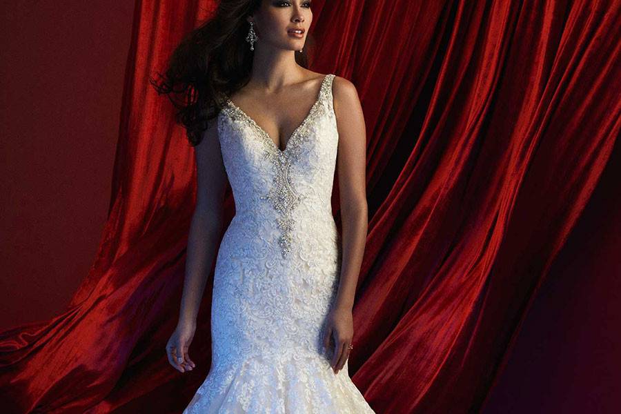 Style C360 <br> Cutaway lace and a high beaded collar add modern structure to this classic form fitting gown.