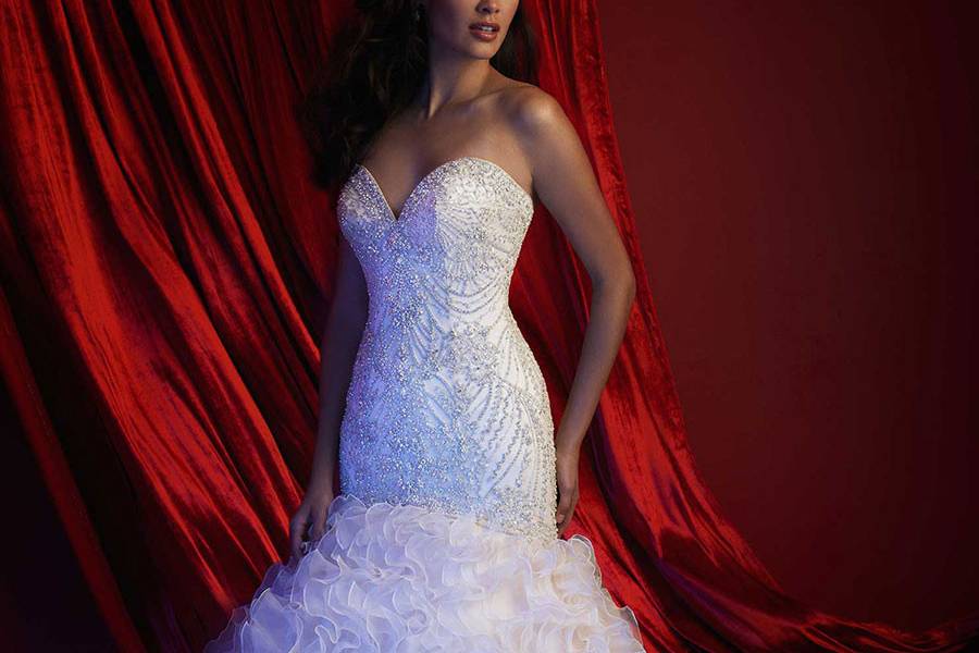 Style C363 <br> Beading and delicate lace compose this strapless gown.