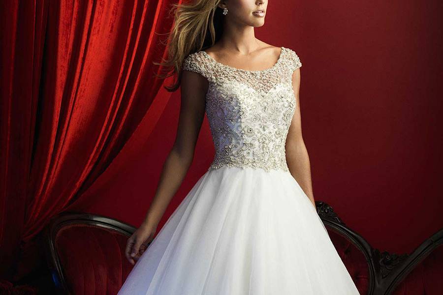 Style C372 <br> Ethereal layers of ruffles compose and a lace bodice contrast textures in this strapless gown.