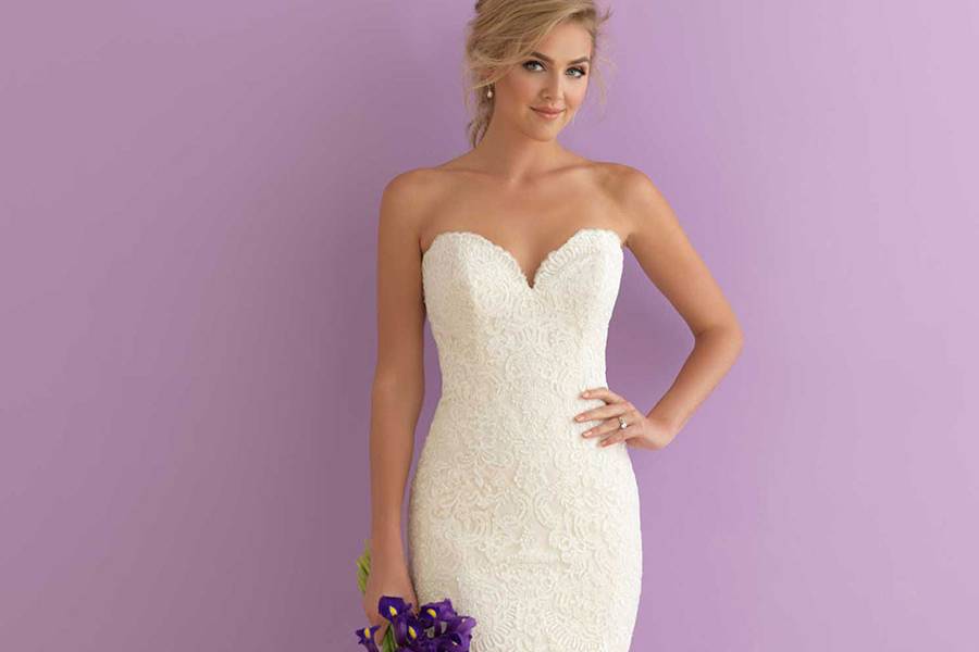 Style 2906 <br> Striking yet subtle, this fit-and-flare strapless gown features a gorgeous train and scalloped edging.