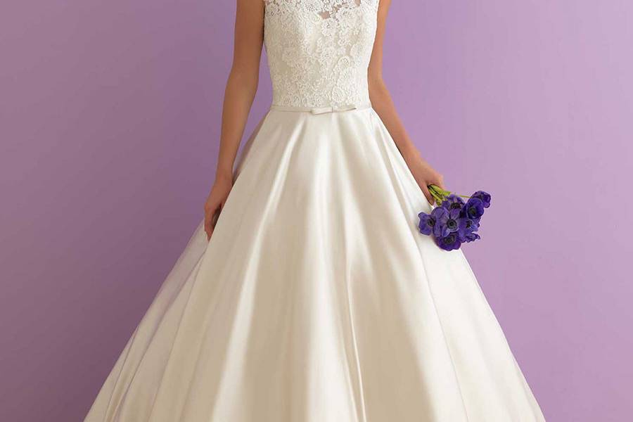 Style 2913 <br> This lace gown features a gently scooped back and chapel length train.