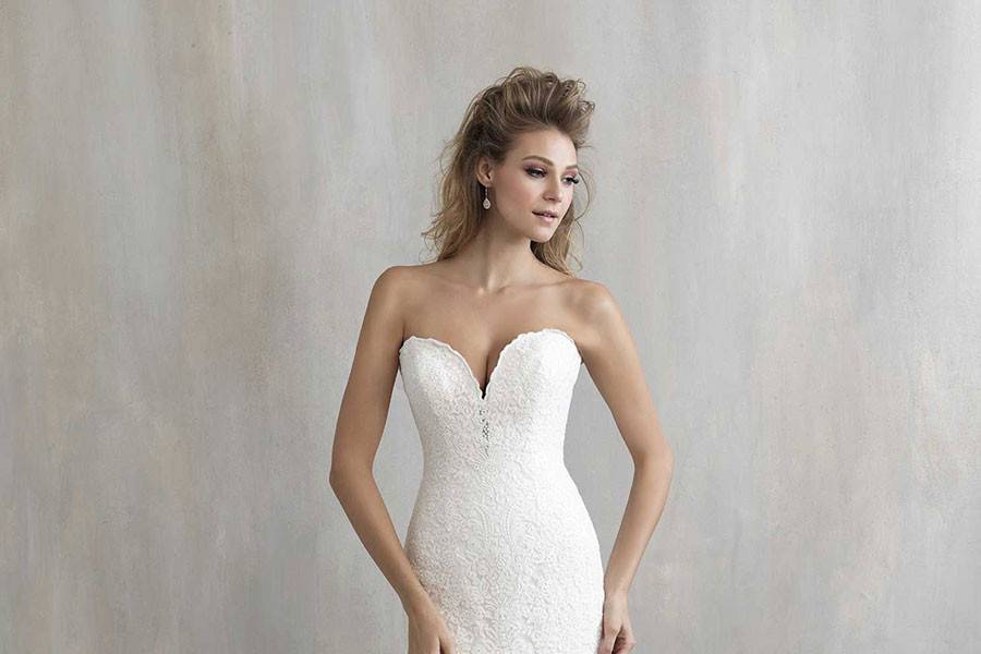 Style MJ215 <br> Ideal either for accessorizing or for striking simplicity, this figure-emphasizing gown demands attention in a beautifully subtle way.