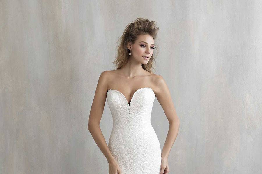 Style MJ221 <br> There is beauty in simplicity, but we can't resist a little sparkle — so we wove sequins into the lace of this barely-flared column gown.