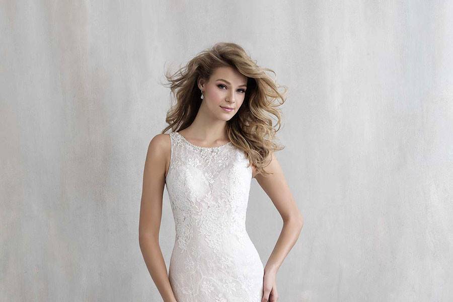 Style MJ220 <br> A high neckline and sleek silhouette are paired with sheer lace and crystal beading along the back.