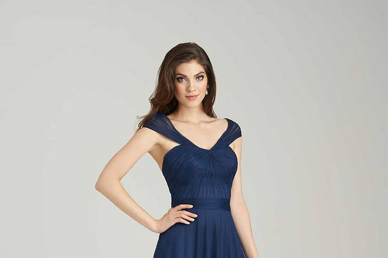 Style 1450 <br> Soft netting creates a delicate silhouette in this versatile bridesmaids dress.