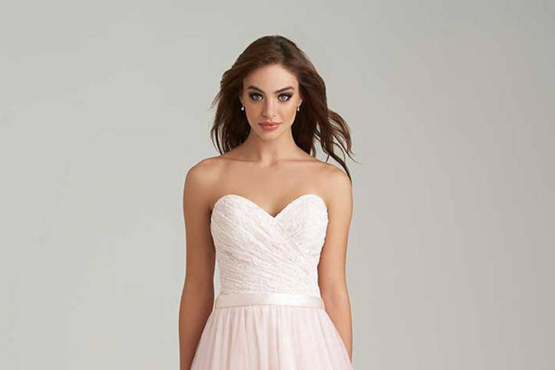 Style 1450 <br> Soft netting creates a delicate silhouette in this versatile bridesmaids dress.