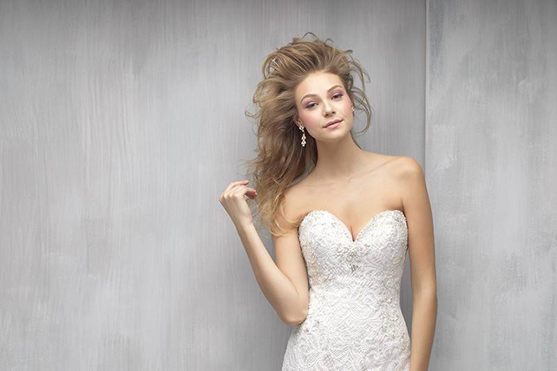 Madison James	Style	MJ15	<br>	This gown is nothing short of incredible. The scalloped beaded lace is beautiful on its own, but the back not only features a modified keyhole opening but a gauzy train of English net.