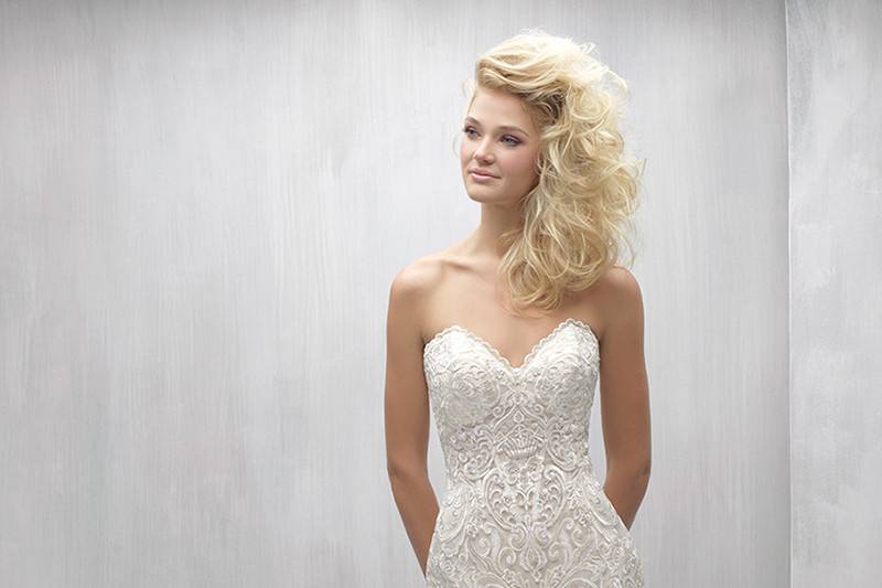 Style MJ259 <br> This richly embroidered strapless gown is paired with a soft tulle skirt and hem lace.