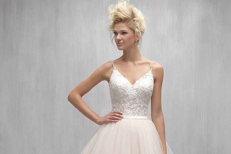 Style MJ250 <br> Asymmetrical layers of tulle add an edgy element to this romantic ballgown.
