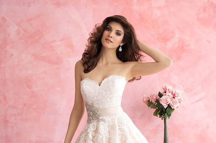 Style 2809 <br> This ballgown is for the lover of all things feminine. It features a floral patterned lace, tulle and a gorgeous Swarovski crystal accent. 