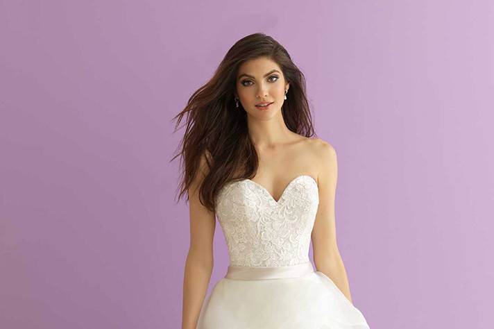 Style 2864 <br> A softly scooped neckline and gorgeous back detailing are featured in this lace gown. 